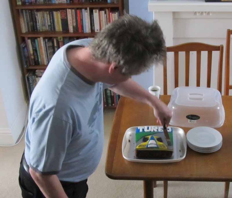 Andy cutting the cake.jpg