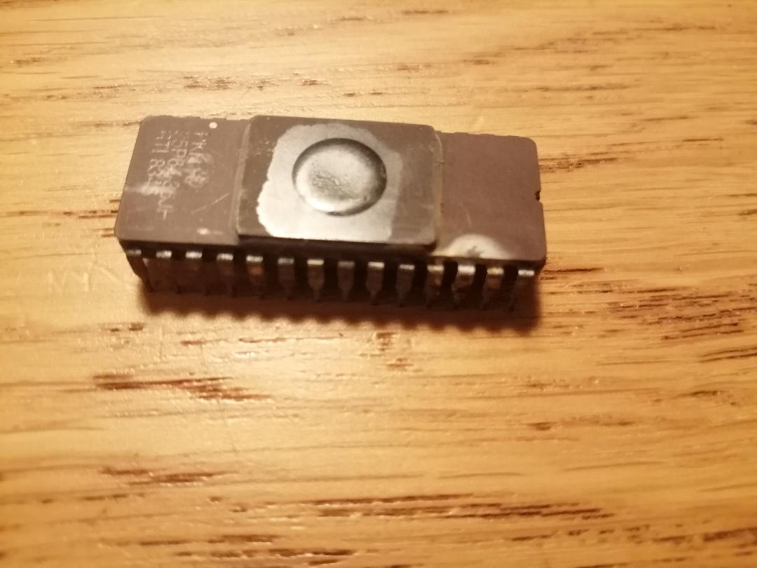 EPROM looks very bad, looks like something have shorted the pins leaving a mark there.