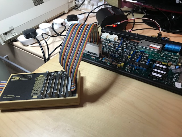 The Zicon connects to the Z80 with a 40 way IC clip. Then a box, which is an adpter that allows it to work with Z80, 6502, 6809 or 6800 processors. On the other end is a large box that looks a bit like an oscilloscope. It's got a 9&quot; CRT and some buttons.